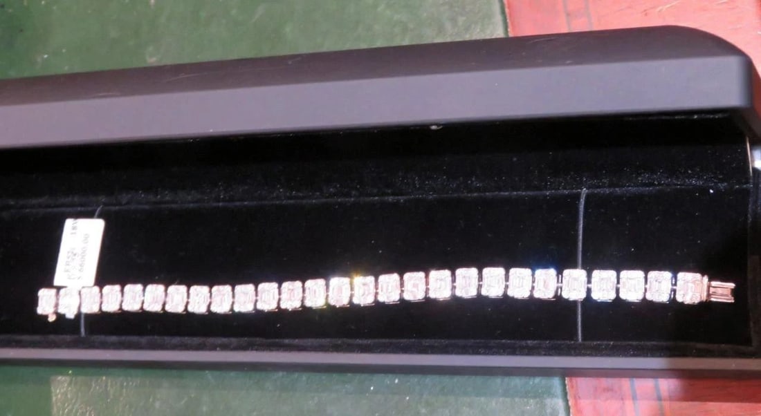 18KT GOLD GLITTERING FANCY BAGUETTE DIAMOND TENNIS BRACELET (1 of 2)