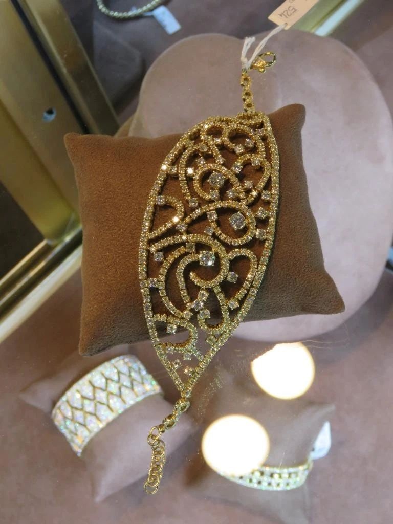 18KT GOLD FANCY DIAMOND WRAP BANGLE BRACELET: 18KT GOLD FANCY DIAMOND WRAP BANGLE BRACELET The Following Item we are offering is this Beautiful Rare Important 18KT Gold Sparkling Wrap Bracelet FEATURES Magnificent Rare Gorgeous Array of Fancy Cut