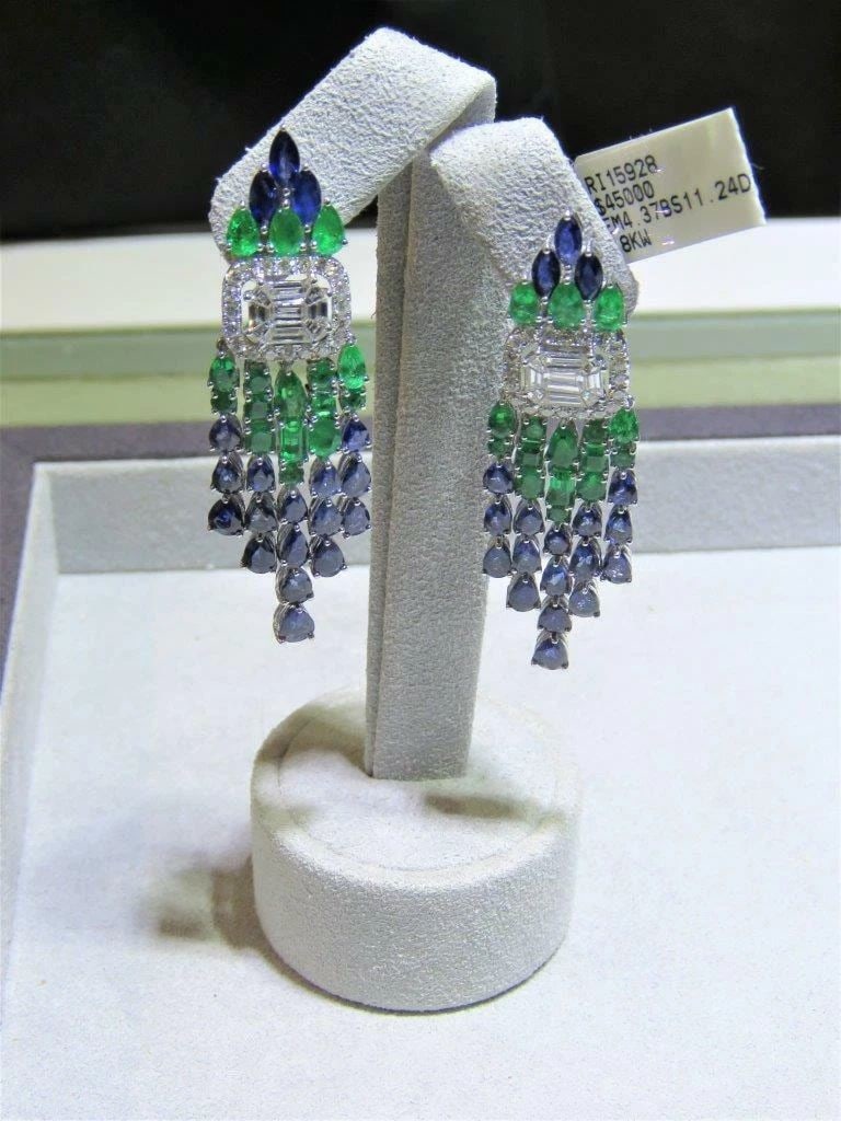 18KT EMERALD BLUE SAPPHIRE BAGUETTE DIAMOND EARRINGS: 18KT EMERALD BLUE SAPPHIRE BAGUETTE DIAMOND EARRINGS The Following Items we are offering is a Rare Important Radiant Pair of GORGEOUS 18KT GOLD EMERALD, BLUE SAPPHIRE AND BAGUETTE DIAMOND DANGLE EARRI