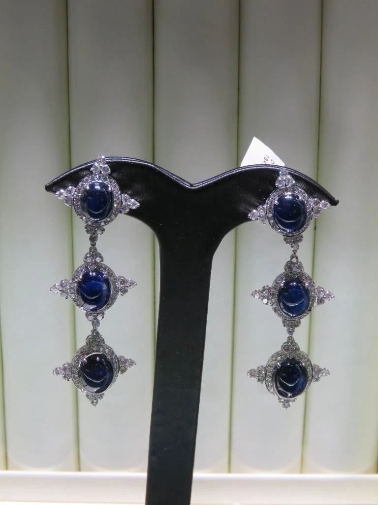 18KT GOLD FANCY SAPPHIRE DIAMOND DANGLE EARRINGS: 18KT GOLD FANCY SAPPHIRE DIAMOND DANGLE EARRINGS The Following Item we are offering are these Extremely Rare Beautiful 18KT Gold Fine Large Fancy Blue Sapphire and White Diamond Dangle Earrings. Each