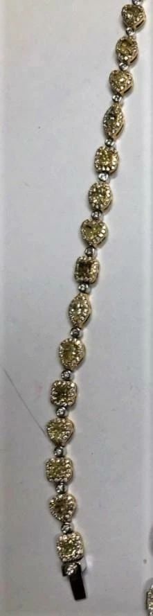 18KT FANCY 6CT YELLOW DIAMOND WHITE DIAMOND BRACELET: 18KT FANCY 6CT YELLOW DIAMOND WHITE DIAMOND BRACELET 18KT FANCY 6CT YELLOW DIAMOND WHITE DIAMOND BRACELET The Following Items we are offering is a Rare Important Radiant Pair of 18KT White Gold Large