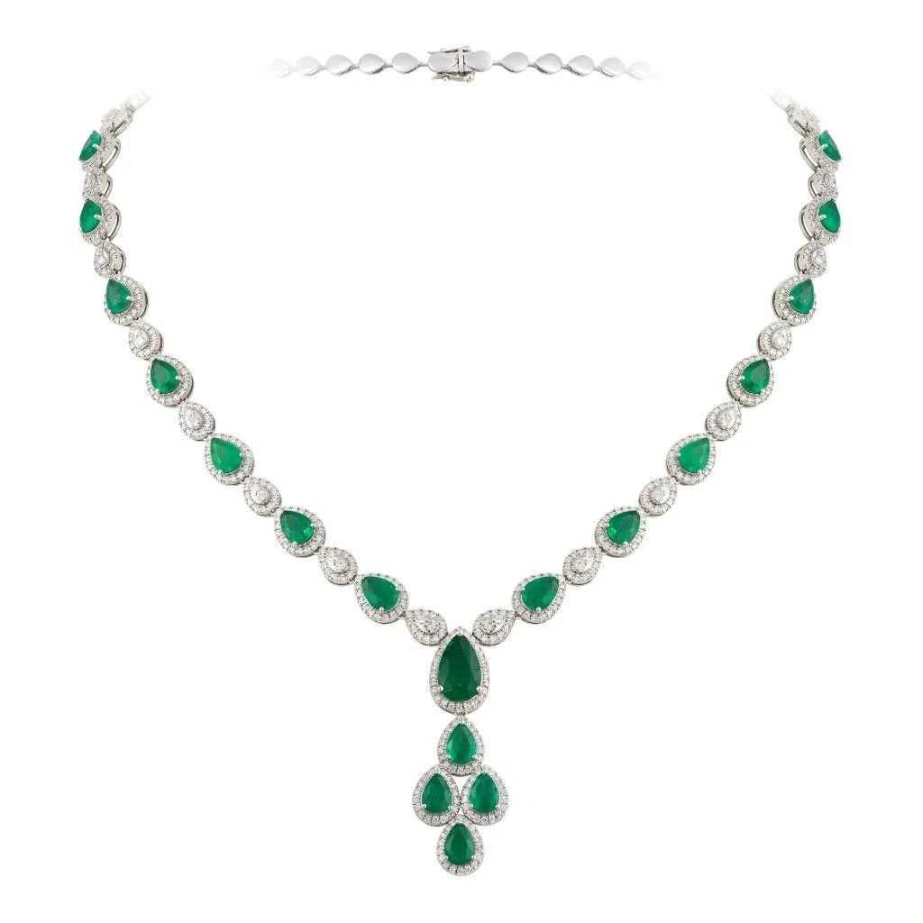 18KT GOLD GORGEOUS GLITTERING LARGE EMERALD DIAMOND DROP NECKLACE: Description LAST CALL, LAST CHANCE!!! LIQUIDATION SALE!!! The Following Item we are offering is this Rare Important Radiant 18KT Gold Gorgeous Glittering and Sparkling Magnificent Fancy Emerald and Di