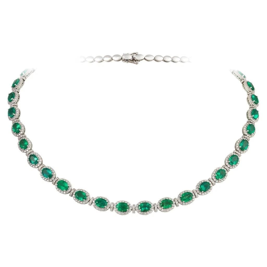18KT GOLD GORGEOUS FANCY DIAMOND EMERALD STRAND NECKLACE: 18KT GOLD GORGEOUS FANCY DIAMOND EMERALD STRAND NECKLACE The Following Item we are offering is a Rare Important Radiant 18KT Gold Necklace with Magnificent Large Fancy Oval Cut Emeralds Flanked by Fin