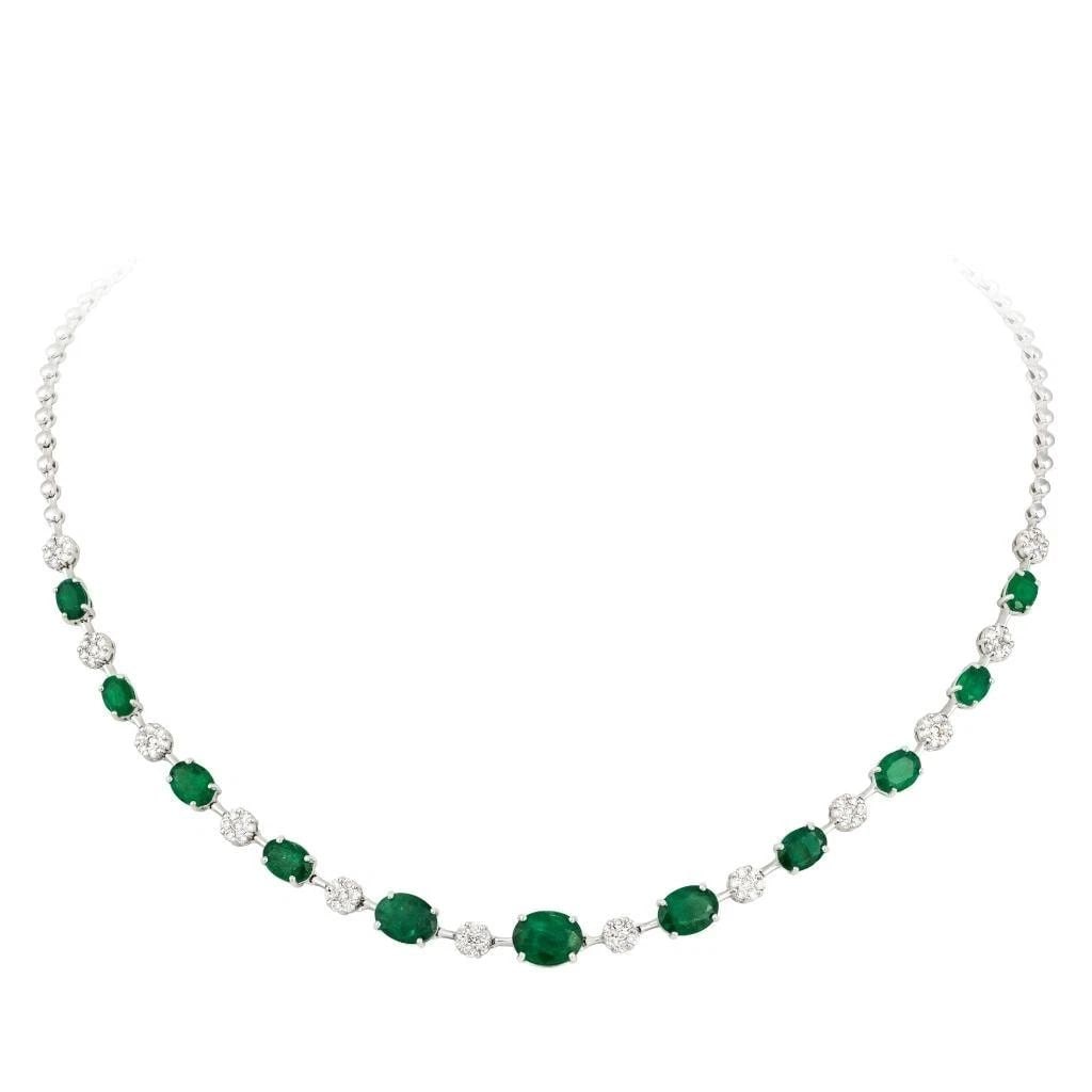 18KT GOLD GORGEOUS FANCY DIAMOND EMERALD STRAND NECKLACE: 18KT GOLD GORGEOUS FANCY DIAMOND EMERALD STRAND NECKLACE The Following Item we are offering is a Rare Important Radiant 18KT Gold Necklace with Magnificent Large Fancy Oval Cut Emeralds Flanked by Fin