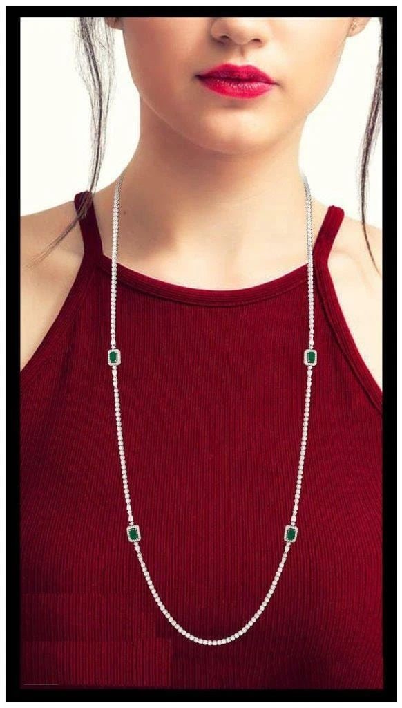 18KT WHITE DIAMOND EMERALD LONG STRAND NECKLACE: 18KT WHITE DIAMOND EMERALD LONG STRAND NECKLACE The Following Item we are offering is this Rare Beautiful Important 18KT Gold Long Fancy Emerald Diamond Necklace. Necklace is Exquisitely is adorned wi
