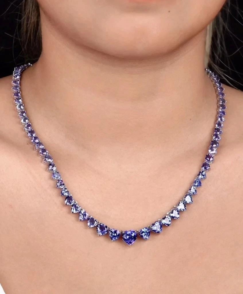 GLITTERING LARGE FANCY GRADUATED HEART TANZANITE NECKLACE: GLITTERING LARGE FANCY GRADUATED HEART TANZANITE NECKLACE The Following Item we are offering is a Rare Important Spectacular and Brilliant 18KT Gold Large Gorgeous Graduated Tanzanite Heart Strand Nec