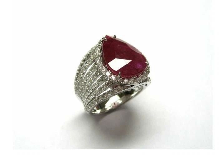 18KT LRG GORGEOUS 12CT RUBY DIAMOND RING: 18KT LRG GORGEOUS 12CT RUBY DIAMOND RING The Following Items we are offering is a Rare Important Radiant 18KT WHITE GOLD LARGE RUBY AND DIAMOND RING. Ring is comprised a Magnificent Large Finely Set S