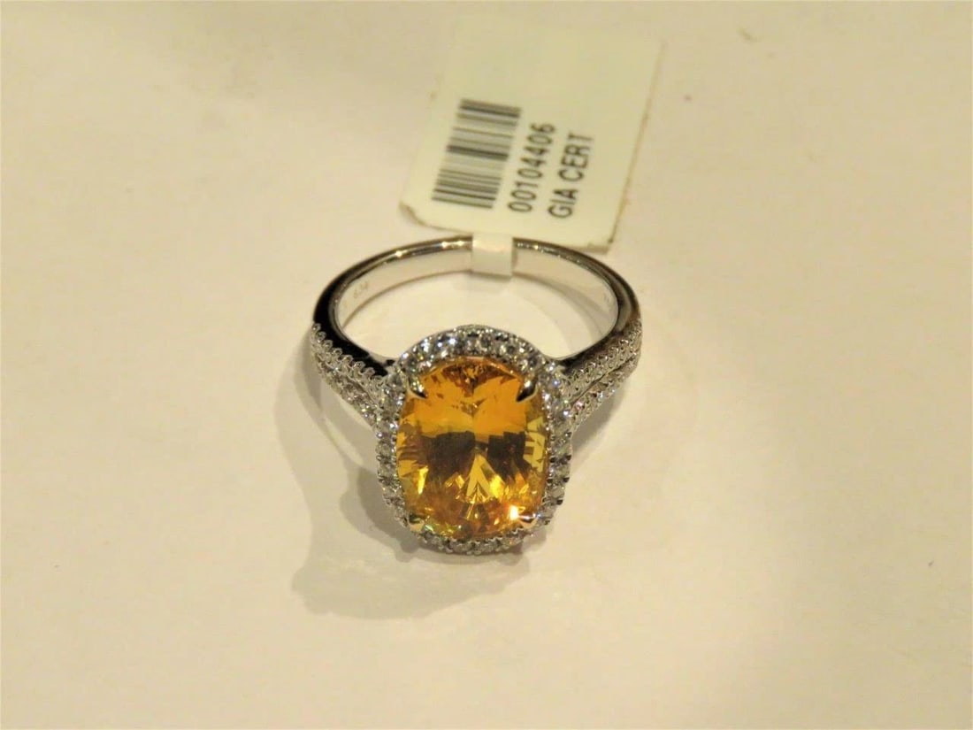 18KT 7.50CT FANCY YELLOW SAPPHIRE DIAMOND RING: 18KT 7.50CT FANCY YELLOW SAPPHIRE DIAMOND RING The Following Items we are offering is this Rare Important Radiant 18KT Gold Winston Style LARGE Glittering and Sparkling Magnificent Fancy Yellow Sapphi