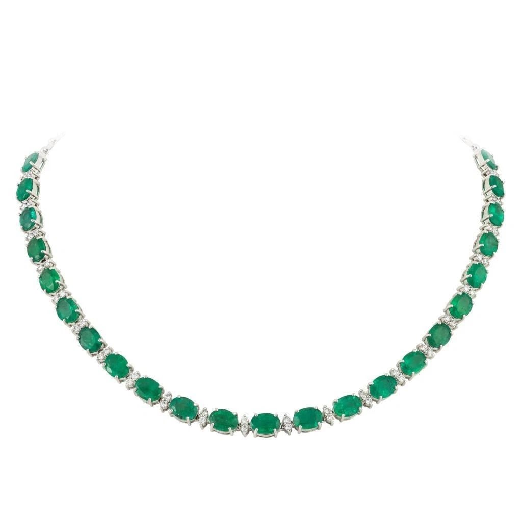 18KT FANCY GORGEOUS EMERALD DIAMOND STRAND NECKLACE: 18KT FANCY GORGEOUS EMERALD DIAMOND STRAND NECKLACE The Following Items we are offering is this Rare Important Radiant 18KT Gold Gorgeous and Sparkling Magnificent Fancy Emerald Cut Emerald and Diamon