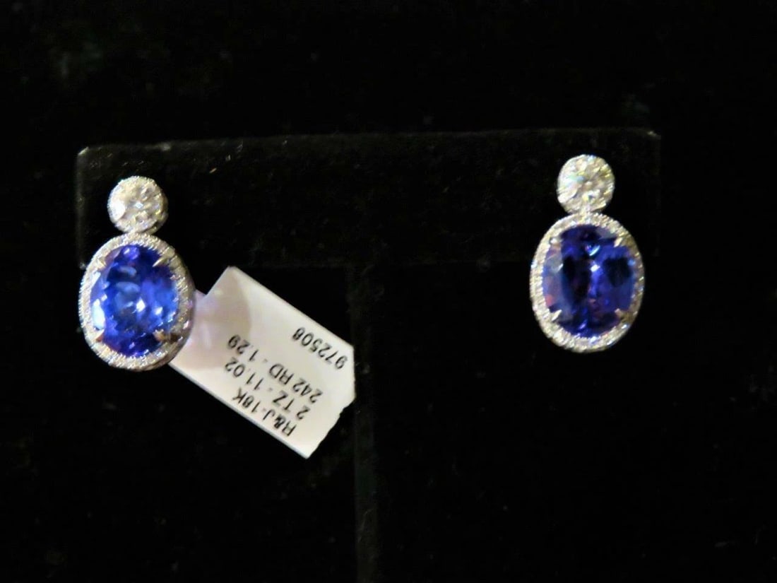 18KT GOLD LRG GORGEOUS 12.50CT TANZANITE AND DIAMOND EARRINGS: 18KT GOLD LRG GORGEOUS 12.50CT TANZANITE AND DIAMOND EARRINGS The Following Items we are offering is a Rare Important Radiant Pair of 18KT WHITE GOLD LARGE TANZANITE AND DIAMOND EARRINGS. Earrings are