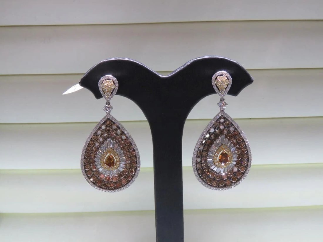18KT GOLD FANCY COGNAC DIAMOND DANGLEEARRINGS: 18KT GOLD FANCY COGNAC DIAMOND DANGLEEARRINGS The Following Item we are offering are these Extremely Rare Beautiful 18KT Gold Fine Large Fancy Orange and Cognac Diamond Dangle Earrings. Each Earring f