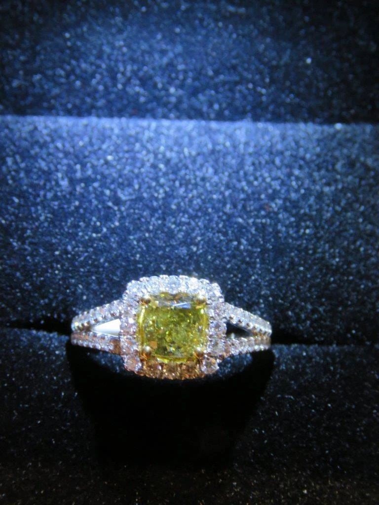 18KT YELLOW DIAMOND WHITE DIAMOND RING: 18KT YELLOW DIAMOND WHITE DIAMOND RING The Following Item we are offering is this Beautiful Rare Important 18KT Gold GIA Certified Brilliant Yellow Diamond Ring. Ring is comprised of a Magnificent Rar