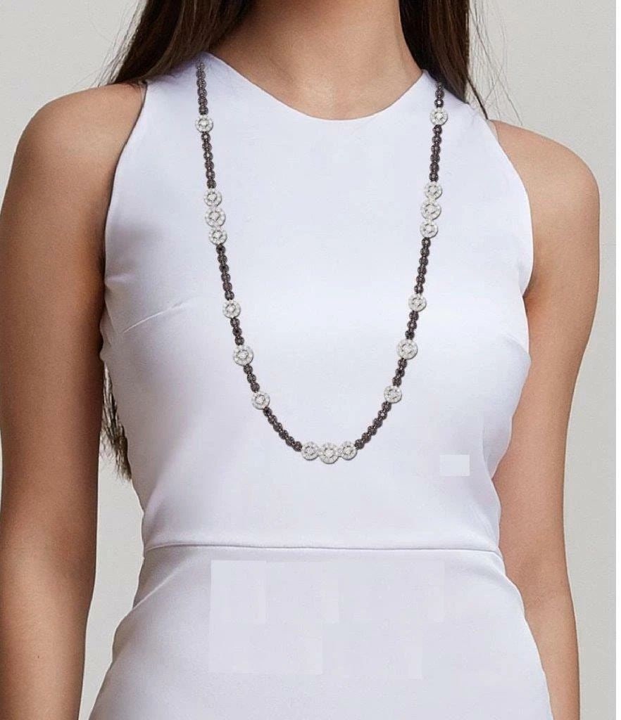 18KT GOLD WHITE DIAMOND BLACK DIAMOND NECKLACE: 18KT GOLD WHITE DIAMOND BLACK DIAMOND NECKLACE The Following Item we are offering is this Rare Beautiful Important 18KT Gold Long Fancy Black Diamond Necklace. Necklace is Exquisitely is adorned with