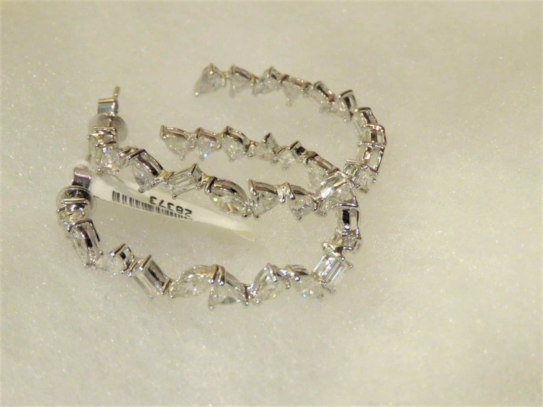 18KT LRG DIAMOND BAGUETTE CLUSTER HOOP EARRINGS: 18KT LRG DIAMOND BAGUETTE CLUSTER HOOP EARRINGS The Following Items we are offering are these Rare Important Radiant 18KT Gold Large Baguette Fancy Diamond Hoop Glistening Diamond Earrings. Earrings a