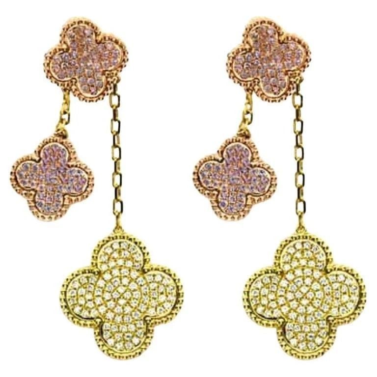 18KT FANCY YELLOW DIAMOND CLOVER PINK DIAMOND EARRINGS: 18KT FANCY YELLOW DIAMOND CLOVER PINK DIAMOND EARRINGS The Following Item we are offering is A Pair of Rare 18KT Gold Fancy Pink Diamond White Diamond Clover Earrings. Earrings are comprised of Finely