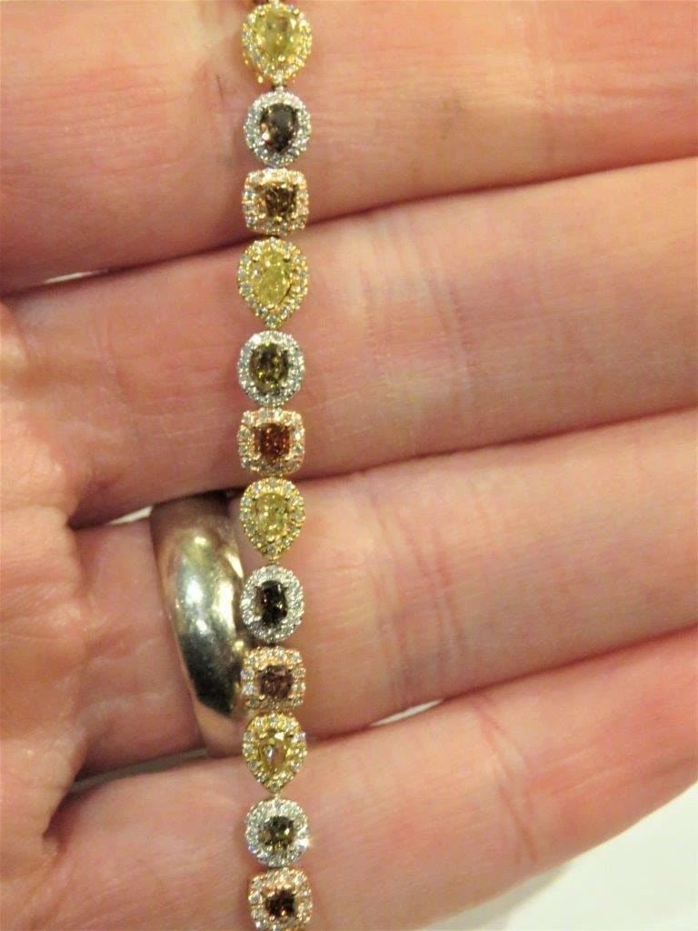 18KT GOLD FANCY YELLOW DIAMOND COGNAC TENNIS BRACELET: 18KT GOLD FANCY YELLOW DIAMOND COGNAC TENNIS BRACELET The Following Item we are offering is this Rare Important 18KT Tri Color Braclet Rose Gold, Yellow Gold, White Gold FANCY MULTI COLORED DIAMOND GO