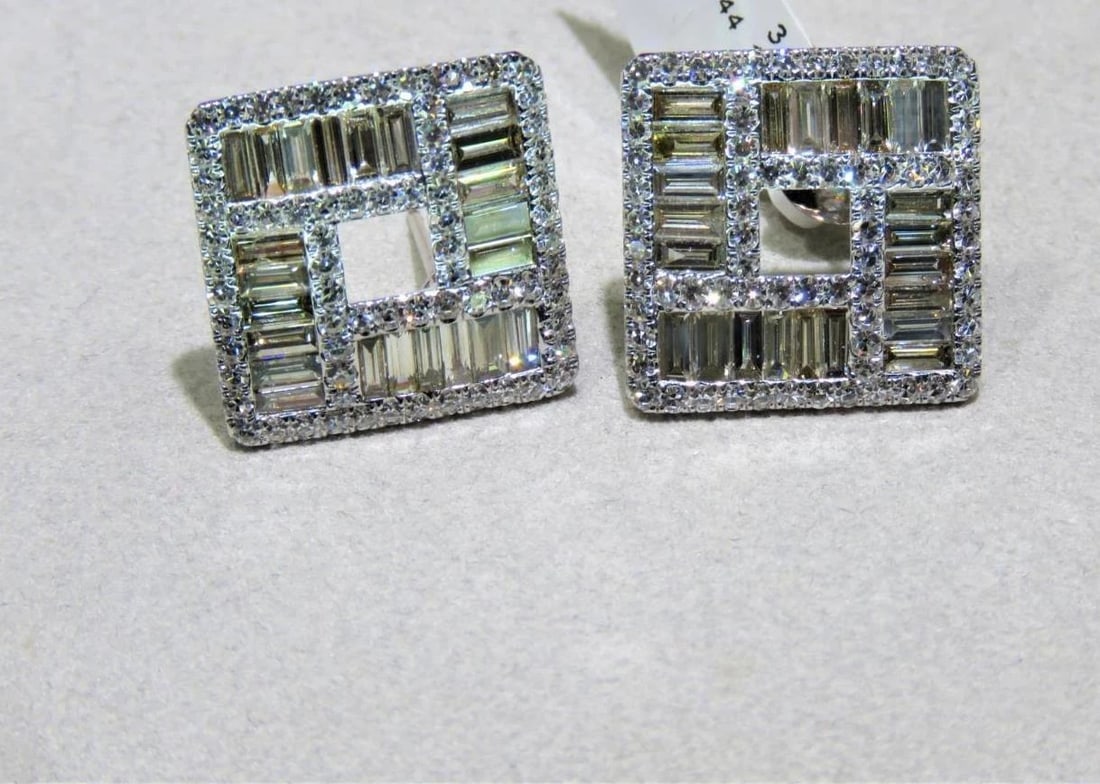 18KT GLITTERING FANCY TRILLION BAGUETTE DIAMOND EARRINGS: 18KT GLITTERING FANCY TRILLION BAGUETTE DIAMOND EARRINGS The Following Item we are offering are these Extremely Rare Beautiful 18KT Gold Fine Large Fancy Baguette Cut Trillion White Diamond Earrings.