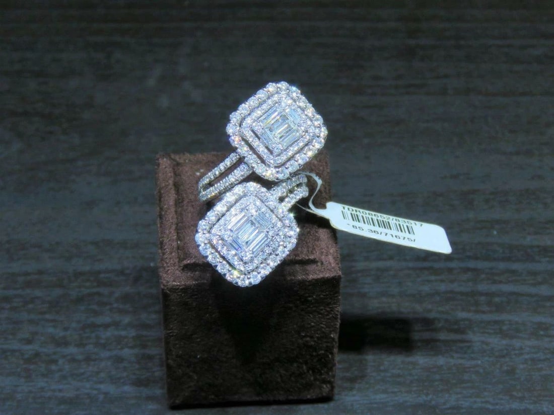 18KT FANCY LRG BAGUETTE DIAMOND CROSSOVER RING: 18KT FANCY LRG BAGUETTE DIAMOND CROSSOVER RING The Following Items we are offering is this Rare Important Radiant 18KT Gold Winston Style Fancy Diamond Baguette Cut Diamond Ring. Ring is comprised of