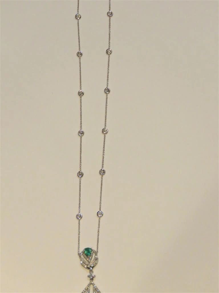 18KT GOLD RARE 6CT DIAMOND EMERALD NECKLACE: 18KT GOLD RARE 6CT DIAMOND EMERALD NECKLACE The Following Items we are offering is a Rare 18KT White Gold Round Diamond and Pear Emerald Necklace. Necklace is comprised of Finely Set Gorgeous Glitteri