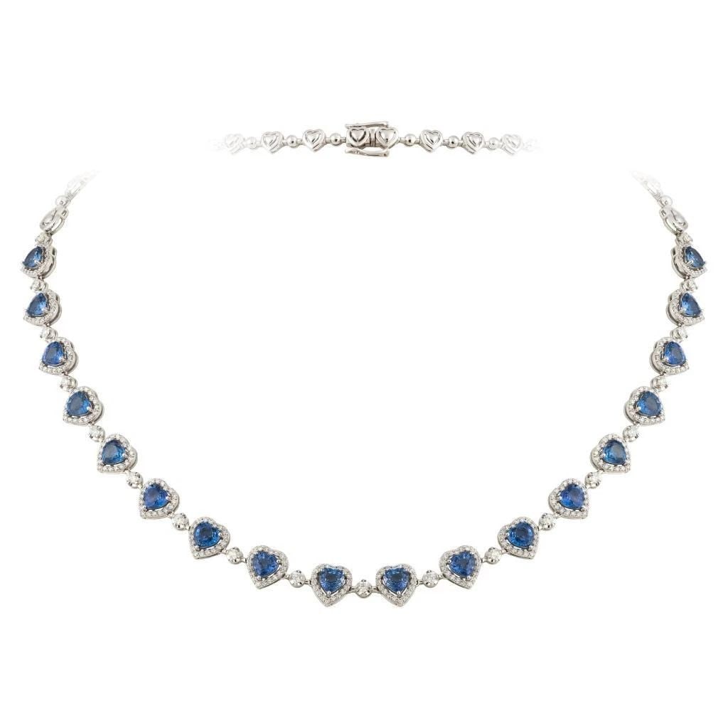 18KT GOLD GORGEOUS FANCY SAPPHIRE HEART DIAMOND NECKLACE: 18KT GOLD GORGEOUS FANCY SAPPHIRE HEART DIAMOND NECKLACE The Following Item we are offering is a Rare 18KT White Gold Blue Sapphire Diamond Heart Necklace. Necklace is comprised of Finely Set Glitteri