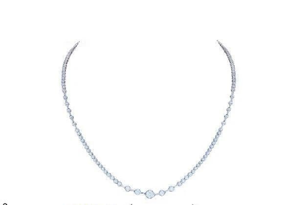 18KT GOLD DIAMOND STRAND NECKLACE: 18KT GOLD DIAMOND STRAND NECKLACE The Following Items we are offering is a Rare 18KT White Gold Diamond Strand Necklace. Necklace is comprised of Finely Set Sparkling Breathtaking Glittering Diamonds