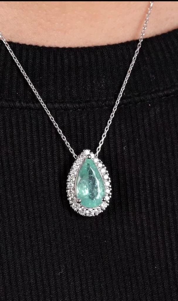18KT GOLD LARGE PARAIBA TOURMALINE NECKLACE: DescriptionDescription LAST CALL, LAST CHANCE!!! LIQUIDATION SALE!!! The Following Item we are offering is a Rare Important Gorgeous 18KT White Gold Glittering Diamond and Paraiba Pendant Necklace!!!!