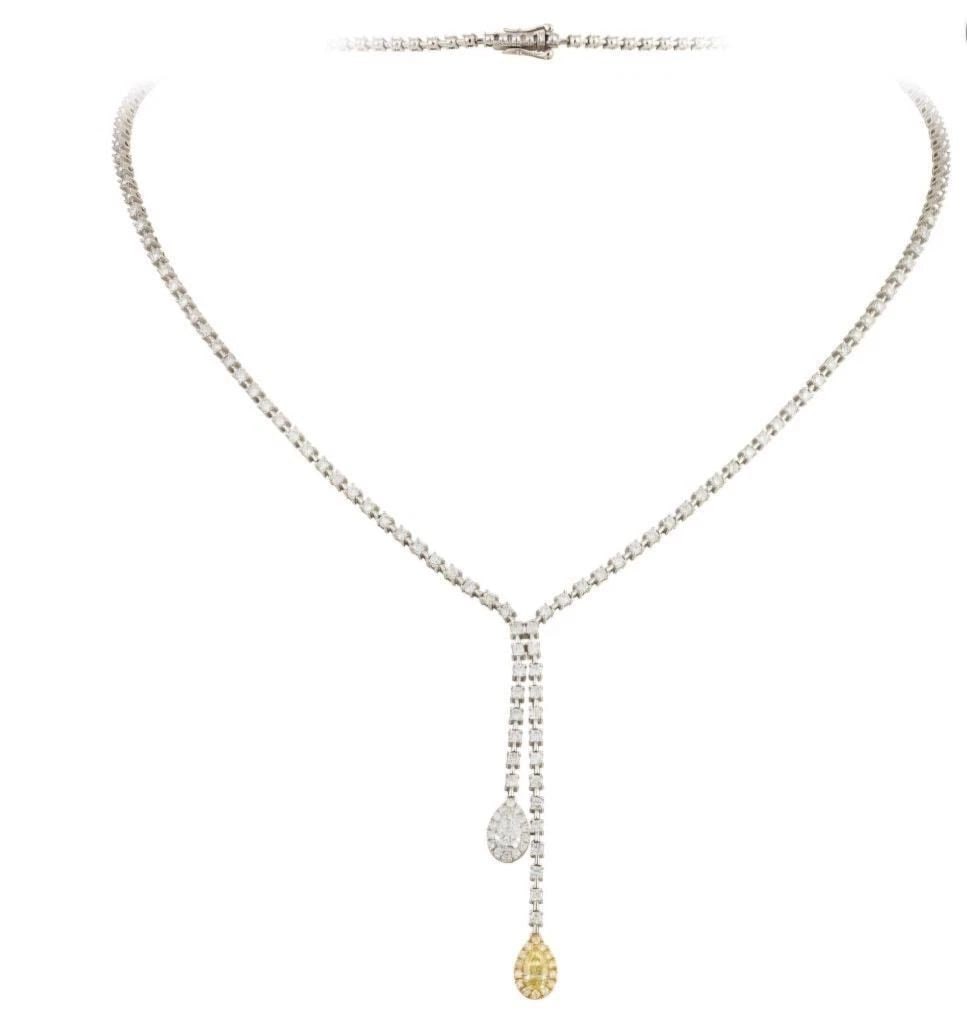18KT GOLD GORGEOUS FANCY YELLOW DIAMOND DROP NECKLACE: 18KT GOLD GORGEOUS FANCY YELLOW DIAMOND DROP NECKLACE The Following Item we are offering is A Rare 18KT Gold Diamond Necklace. Necklace is comprised of Finely Set Glittering Gorgeous White Diamond Yel