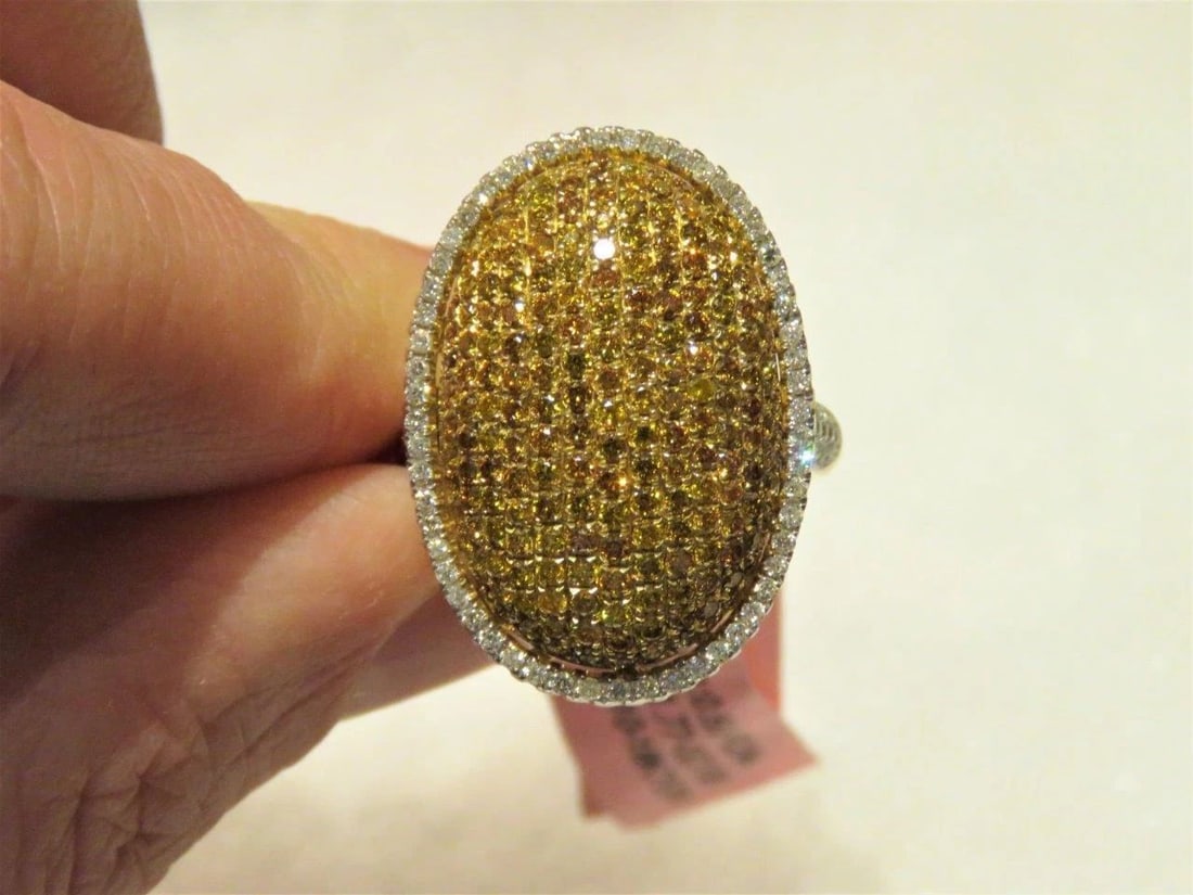 18KT RARE FANCY ORANGE DIAMOND BOMBE RING: 18KT RARE FANCY ORANGE DIAMOND BOMBE RING The Following Item we are offering is this Beautiful Rare Important 18KT Gold RARE Fancy Orange Diamond Ring. Ring is comprised of Magnificent Rare Gorgeous C