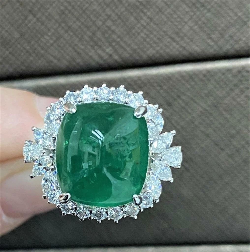 18KT GOLD GORGEOUS 9CT EMERALD CABACHON DIAMOND RING: 18KT GOLD GORGEOUS 9CT EMERALD CABACHON DIAMOND RING The Following Items we are offering is a Rare Important Radiant 18KT WHITE GOLD LARGE EMERALD AND DIAMOND RING. Ring is comprised with a Large Fine