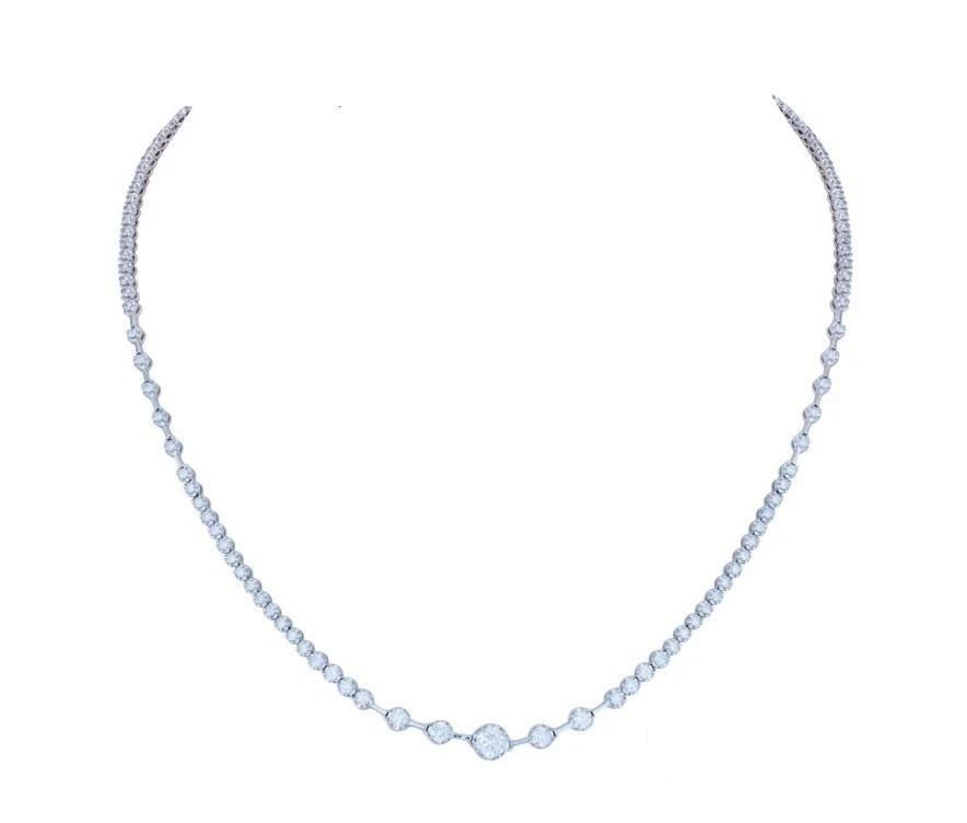 18KT GOLD DIAMOND STRAND NECKLACE: 18KT GOLD DIAMOND STRAND NECKLACE The Following Item we are offering is a Rare 18KT White Gold Tourmaline Heart and Diamond Necklace. Necklace is comprised of a Finely Set Sparkling Gorgeous Graduatin