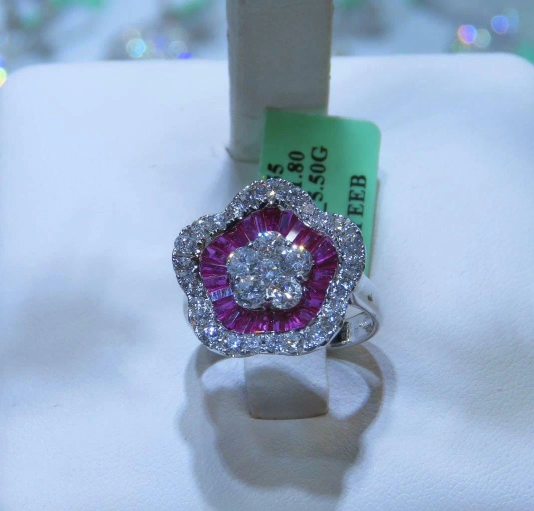 18KT 3.50CT GORGEOUS FANCY RUBY DIAMOND FLORAL RING: 18KT 3.50CT GORGEOUS FANCY RUBY DIAMOND FLORAL RING The Following Items we are offering is a Important Rare 18KT Gold Gorgeous Fancy Ruby and Diamond Floral Flower Ring. Stones are Glittering and Extr
