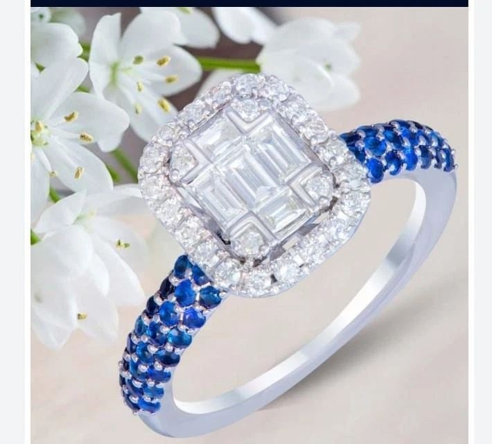 18KT FANCY BAGUETTE DIAMOND SAPPHIRE RING: 18KT FANCY BAGUETTE DIAMOND SAPPHIRE RING The Following Items we are offering is this Rare Important Estate Radiant 18KT White Gold Rare Fancy Glittering and Sparkling Magnificent Diamond Blue Sapphir