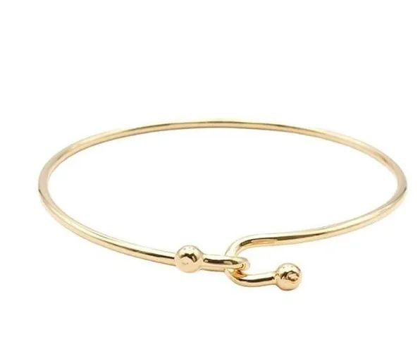 TIFFANY & CO. DOUBLE HOOK K18 YELLOW GOLD LENGTH 16.5CM BRACELET PRE OWNED B1224: TIFFANY & CO. DOUBLE HOOK K18 YELLOW GOLD LENGTH 16.5CM BRACELET PRE OWNED B1224 Item Description Brand Tiffany & Co. Product name double hook bracelet overview Total weight: 8.1g Main material K18YG