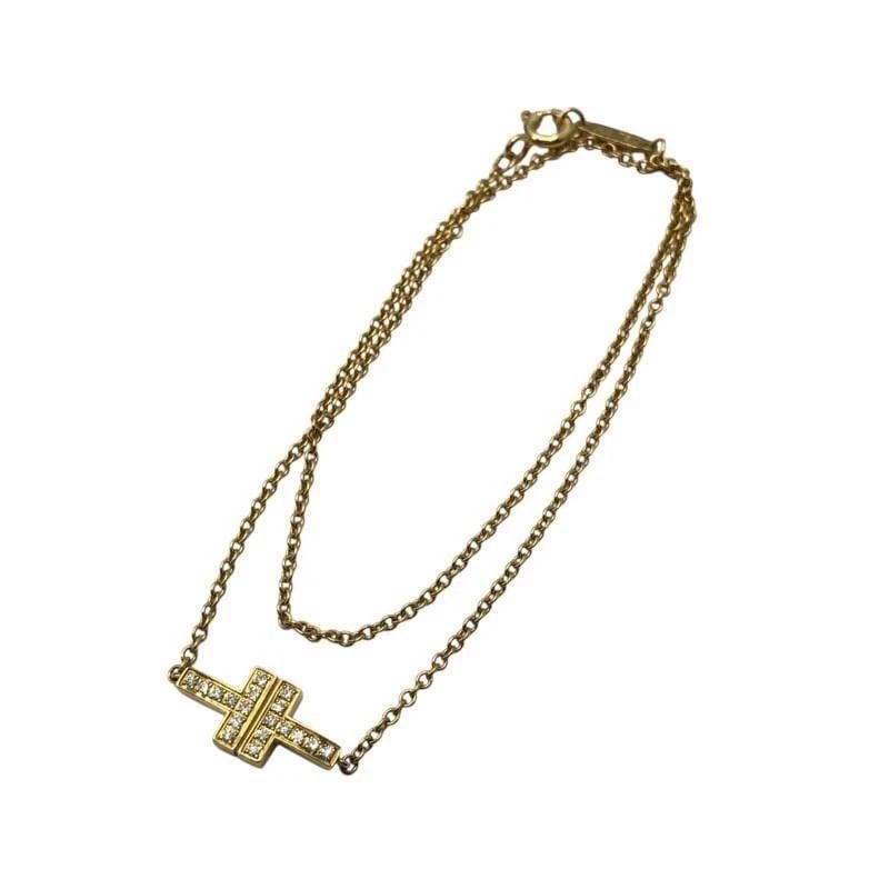 TIFFANY & CO. T TWO DIAMOND K18 GOLD LENGTH 14.5CM BRACELET PRE OWNED: TIFFANY & CO. T TWO DIAMOND K18 GOLD LENGTH 14.5CM BRACELET PRE OWNED Item Description Brand TIFFANY & CO. Product name TTWO Bracelet material 18k gold subject Women's size Length: Approx. 7.1mm Width