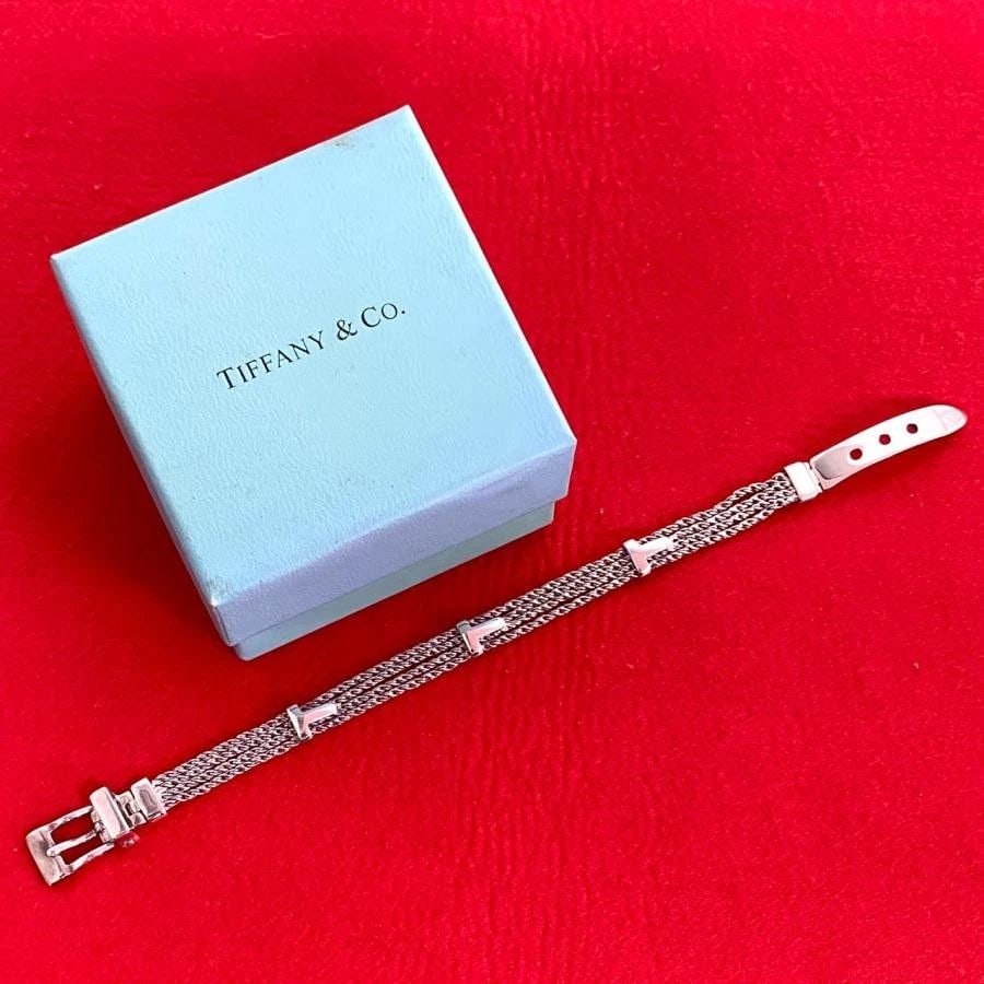TIFFANY & CO. T-ROPE SILVER 925 LENGTH 22.5CM LADIES BRACELET PRE OWNED: TIFFANY & CO. T-ROPE SILVER 925 LENGTH 22.5CM LADIES BRACELET PRE OWNED Item Description Brand/Model TIFFANY&Co. Material 925 silver Color Silver Design ??Shape: Bracelet ??Weight: 20.2g ??Width: App