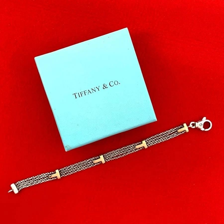 TIFFANY & CO. T ROPE 925 SILVER K18GOLD LENGTH 18.5CM BRACELET PRE OWNED: TIFFANY & CO. T ROPE 925 SILVER K18GOLD LENGTH 18.5CM BRACELET PRE OWNED Item Description Brand/Model TIFFANY&Co. Material 925 Silver / 18K Gold Color Silver x Gold Design ??Shape: Bracelet ??Weight: