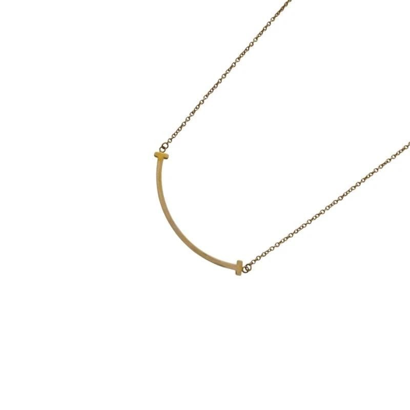TIFFANY & CO. T SMILE SMALL YELLOW GOLD 41-46 CM LENGTH NECKLACE PRE OWNED B0905: TIFFANY & CO. T SMILE SMALL YELLOW GOLD 41-46 CM LENGTH NECKLACE PRE OWNED B0905 TIFFANY & CO. T SMILE SMALL YELLOW GOLD 41-46 CM LENGTH NECKLACE PRE OWNED Item Description brand TIFFANY & CO. Model n