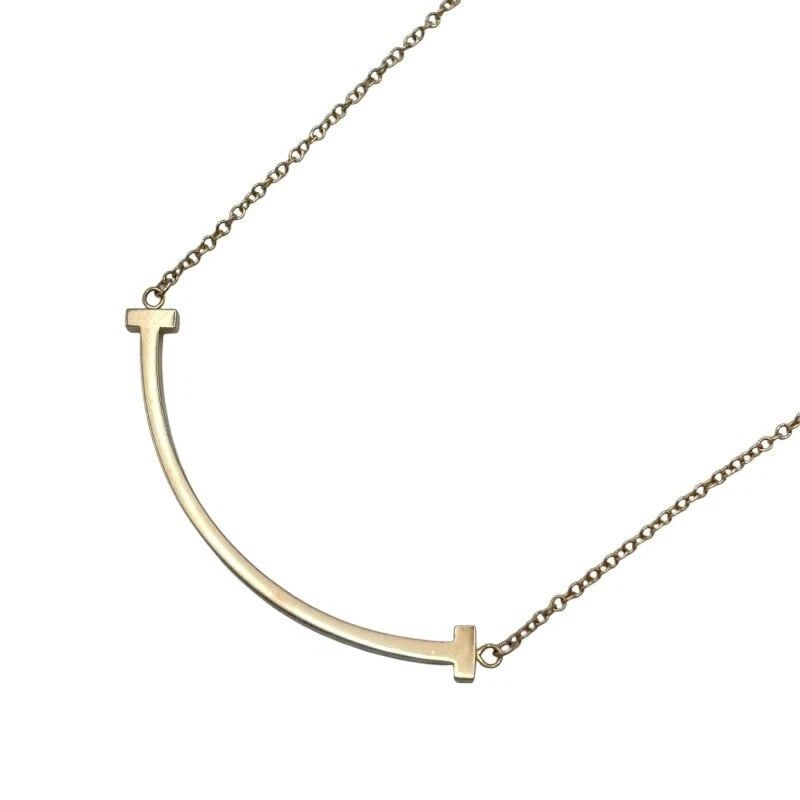 TIFFANY & CO. T SMILE NECKLACE SMALL AU750 PINK GOLD 42CM 2.9G WOMEN'S Y1009: TIFFANY & CO. T SMILE NECKLACE SMALL AU750 PINK GOLD 42CM 2.9G WOMEN'S Y1009 Item Description Brand: TIFFANY & CO.Product Name: T Smile Necklace SmallMaterial: Au750Color: Pink GoldSuitable for: Women