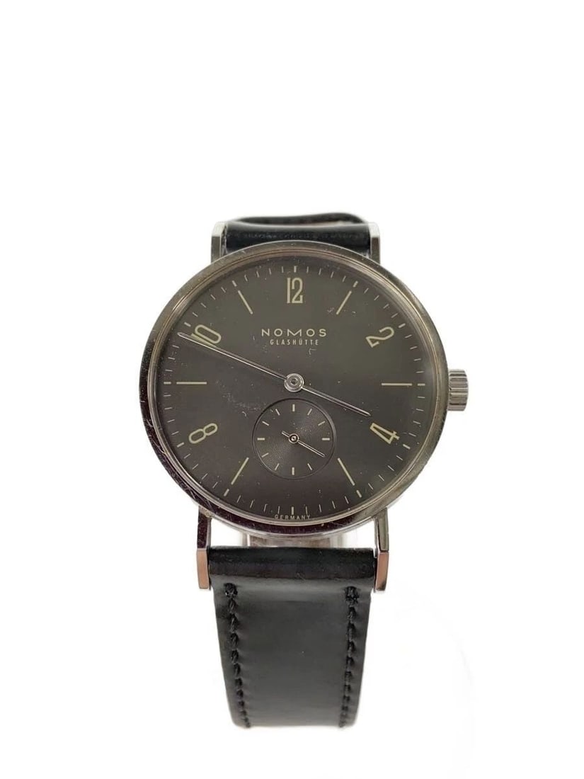 NOMOS TANGENTE MEN'S WATCH: NOMOS TANGENTE MEN'S WATCH Item Description Condition: Used (B)Slight signs of useProduct Description: Leather has scratches and stains / Signs of use / Minor scratches on frameProduct DetailsModel Nu