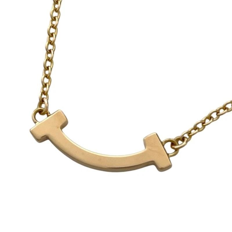 TIFFANY & CO. T SMILE MINI GOLD AU750 44CM LENGTH NECKLACE PRE OWNED: TIFFANY & CO. T SMILE MINI GOLD AU750 44CM LENGTH NECKLACE PRE OWNED TIFFANY & CO. T SMILE MINI GOLD AU750 44CM LENGTH NECKLACE PRE OWNED Item Description brand TIFFANY & CO. Model number 62617659 Pro