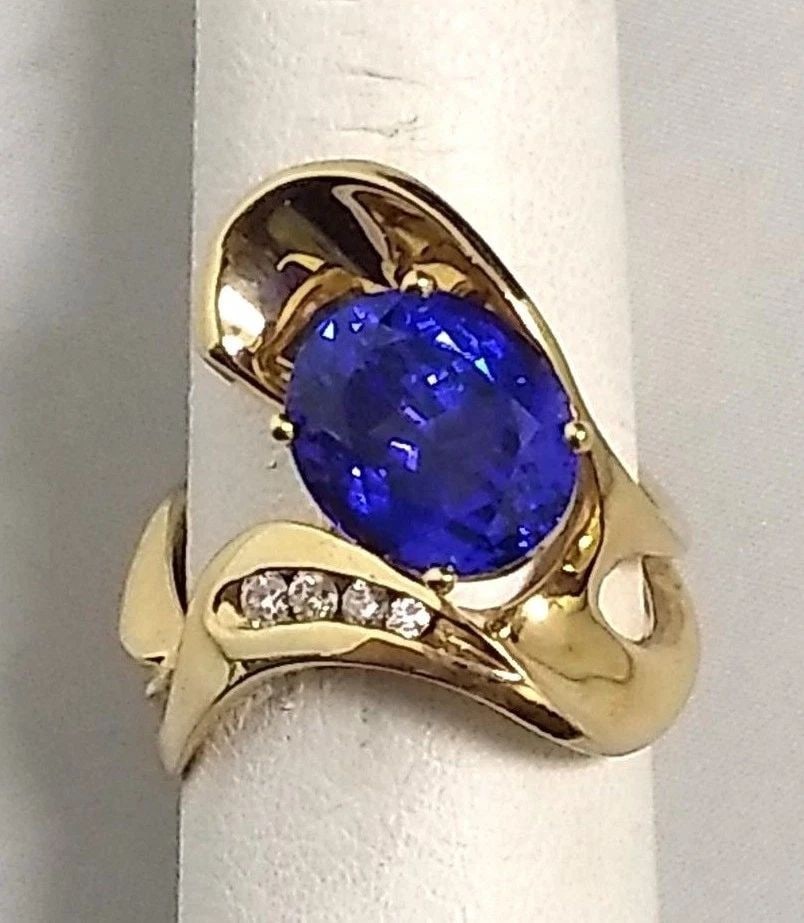 14K YELLOW GOLD 4.0CT TANZANITE AND 0.20CTW DIAMONDS SIZE: 7: 14K YELLOW GOLD TANZANITE AND DIAMONDS SIZE: 7 14k Yellow Gold Tanzanite and Diamonds You are bidding on a 14k Yellow Gold Tanzanite and Diamonds. There are a few minor marks on the ring from being mo