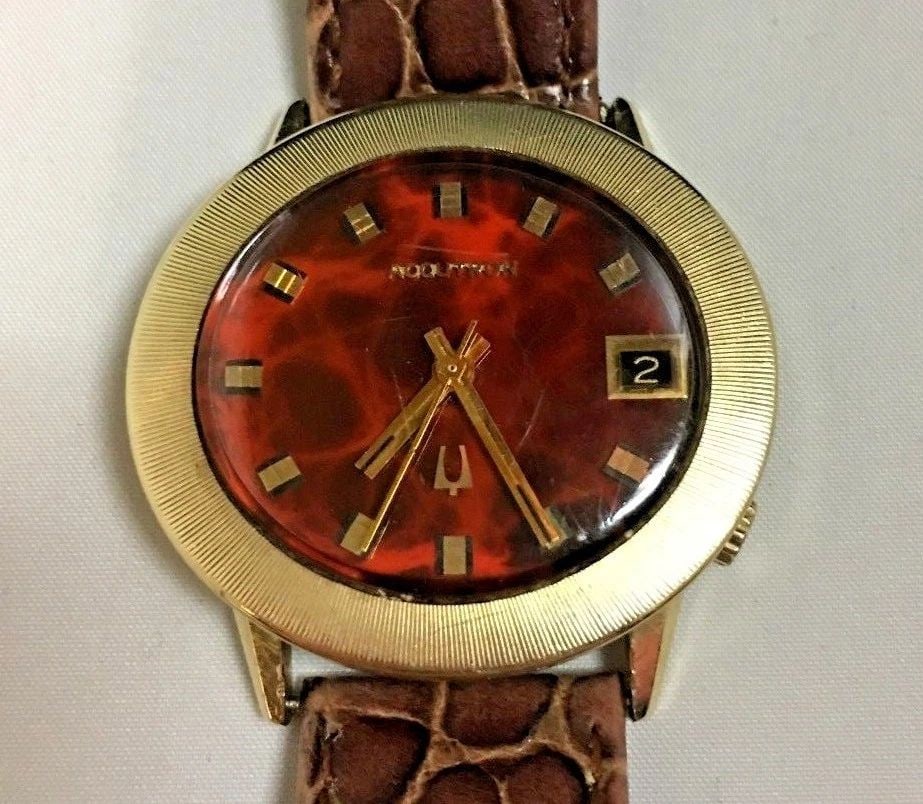VINTAGE SOLID 14K GOLD BULOVA ACCUTRON RED MARBLE DIAL: Vintage solid 14k Gold Bulova Accutron Red Marble Dial You are bidding on a pre-owned 1970's Vintage 14k Gold Bulova Accutron Red Marble Dial. The watch is in excellent working condition. There are sc