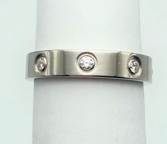 AUTHENTIC CARTIER 18K WHITE GOLD RING 4MM WITH 8 DIAMONDS (SIZE: 6): AUTHENTIC CARTIER 18K WHITE GOLD RING 4MM WITH 8 DIAMONDS (SIZE: 6) Cartier 18k White Gold Ring with 8 Diamonds You are bidding on a Cartier 18k White Gold Ring with 8 Diamonds. The piece has been ful
