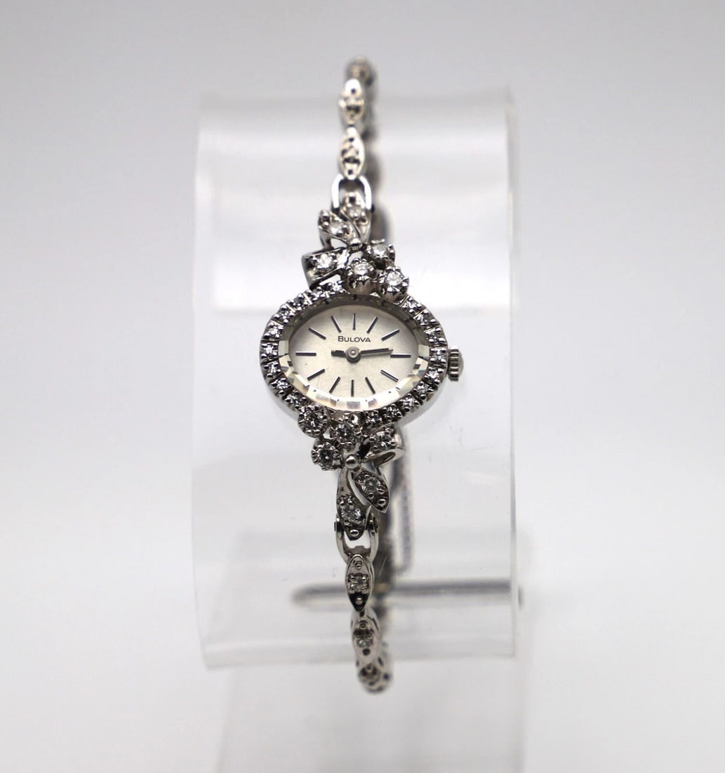 BULOVA 14K WHITE GOLD VINTAGE WATCH WITH 1.0CTW DIAMONDS 21.4 GRAMS TOTAL: BULOVA 14K WHITE GOLD VINTAGE WATCH WITH 1.0CTW DIAMONDS BULOVA 14k White Gold Vintage Watch with Diamonds You are bidding on a BULOVA 14k White Gold Vintage Watch with Diamonds. The watch has been