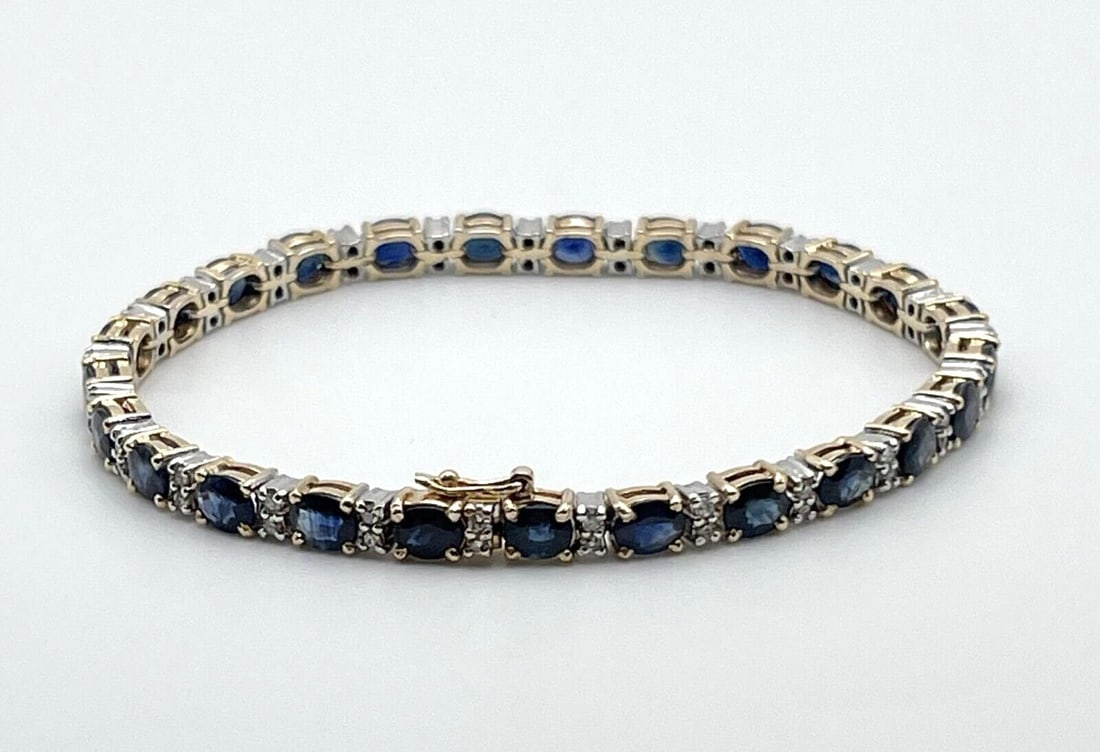 14K GOLD TWO TONED BRACELET SET WITH 12.5CTS SAPPHIRES AND 0.50CTS DIAMONDS 7": 14K GOLD TWO TONED BRACELET SET WITH 12.5CTS SAPPHIRES AND 0.50CTS DIAMONDS 7" 14k Gold Two Toned Bracelet set with 12.5cts Sapphires and 0.50cts Diamonds You are bidding on a 14k Gold Two Toned