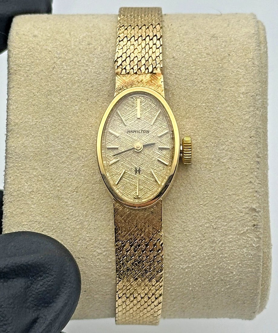 HAMILTON LADIES SOLID 14K GOLD VINTAGE WATCH 25.3 GRAMS TOTAL: Hamilton Ladies 14k Vintage Watch You are bidding on a Hamilton Ladies 14k Vintage Watch. There are few minor scratches on the watch from normal wear and tear, it is in used condition! See pictures