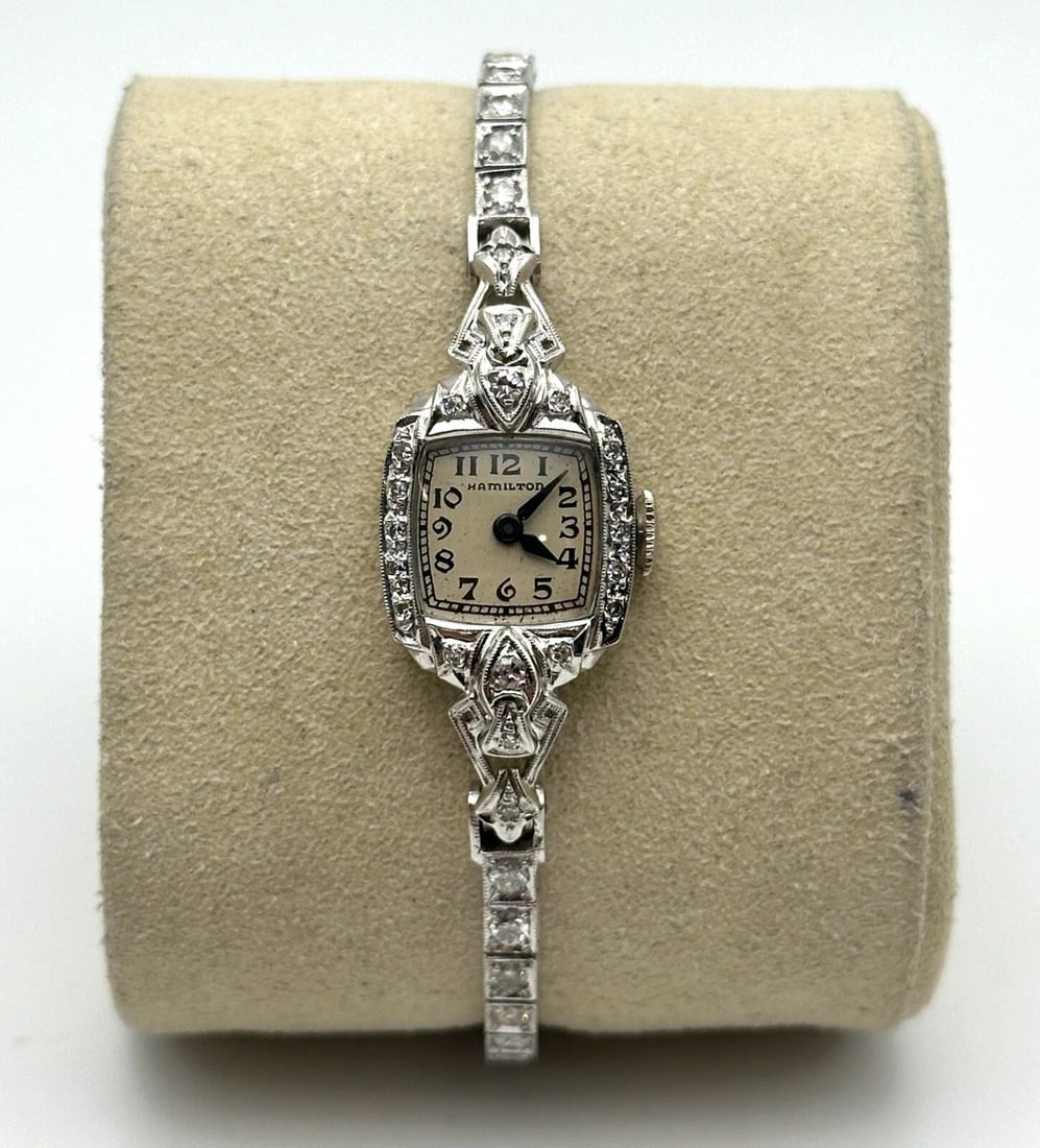 VINTAGE WOMAN'S HAMILTON WATCH 14K WHITE GOLD WITH 1.50CTS OF DIAMONDS: Vintage Woman's Hamilton Watch 14k White Gold with 1.50cts of Diamonds Condition: Used. Material: Solid 14kt white gold case and band (NOT plated/filled). Weighs 11.4 grams without the movement inside