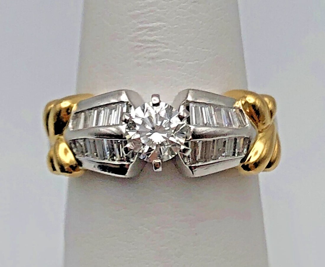 PLATINUM WITH 18KT GOLD RING, 0.57CT CENTER, 1.37CTW DIAMONDS SIZE: 6.75: Platinum with 18kt gold ring, 0.57ct center, 1.37ctw Diamonds Condition: Used, has been cleaned Material: Main body is 900 Platinum / with 18k Yellow Gold side accents Ring Size: 6.75 Weight: 10.0 gra