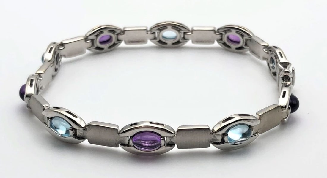 14K WHITE GOLD BRACELET WITH BLUE TOPAZ AND AMETHYST (SIZE: 7.75'') 17.3 GRAMS: 14K WHITE GOLD BRACELET WITH BLUE TOPAZ AND AMETHYST (SIZE: 7.75'') 14k White Gold Bracelet with Blue Topaz and Amethyst You are bidding on a 14k White Gold Bracelet with Blue Topaz and Amethyst. The