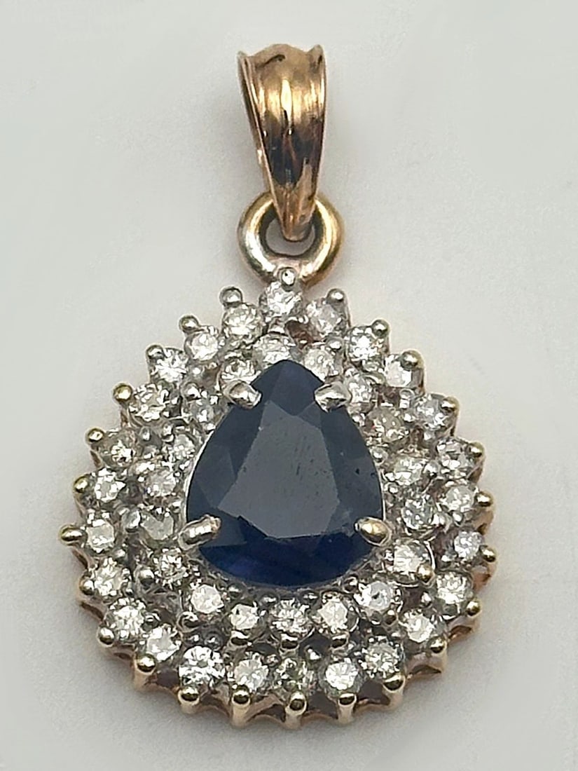 WOMEN'S 14K ROSE GOLD PENDANT WITH 2.25CT PEAR CUT NATURAL SAPPHIRE AND DIAMONDS: WOMEN'S 14K ROSE GOLD PENDANT WITH 9.3X8MM PEAR NATURAL SAPPHIRE AND DIAMONDS Women's 14k Rose Gold Pendant with 9.3x8mm Pear Cut natural Sapphire and Diamonds You are bidding on a pre-owned Women's 1